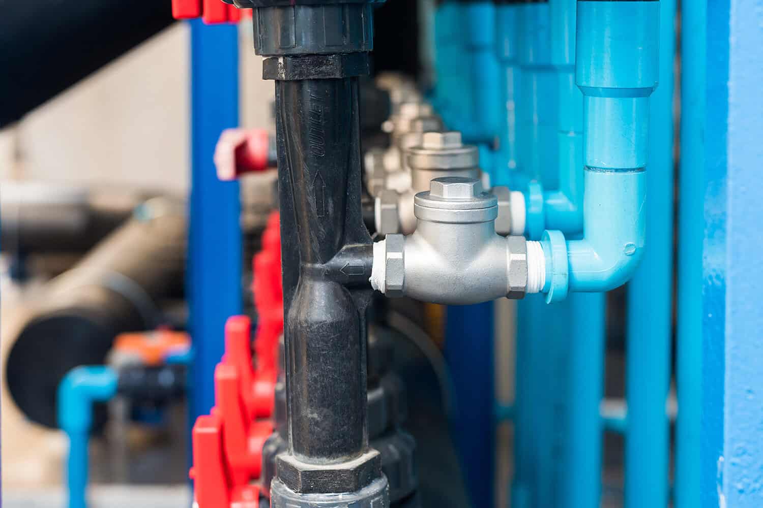 Plumbing system with pipes, valves, and fittings for home or business.