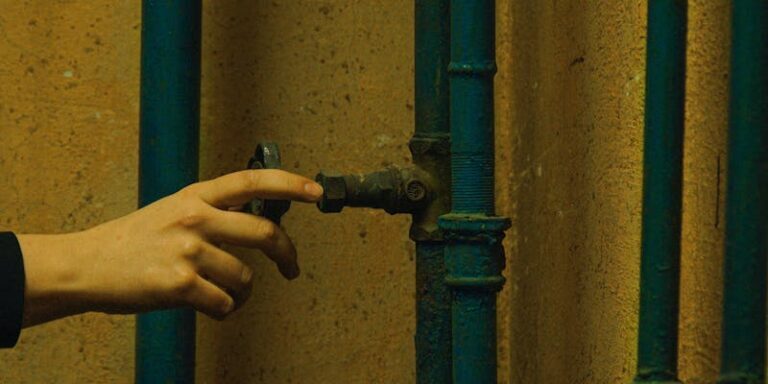 Professional handling metal pipe for drain snake service