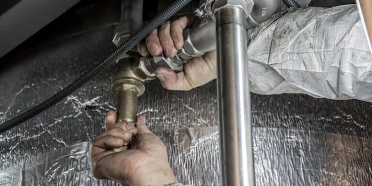 Professional plumber providing emergency service